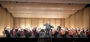 LMHS Orchestra on stage at Jefferson Invitational 