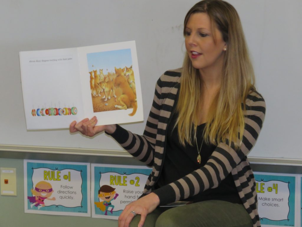 Melissa Bray reads a book to her students.