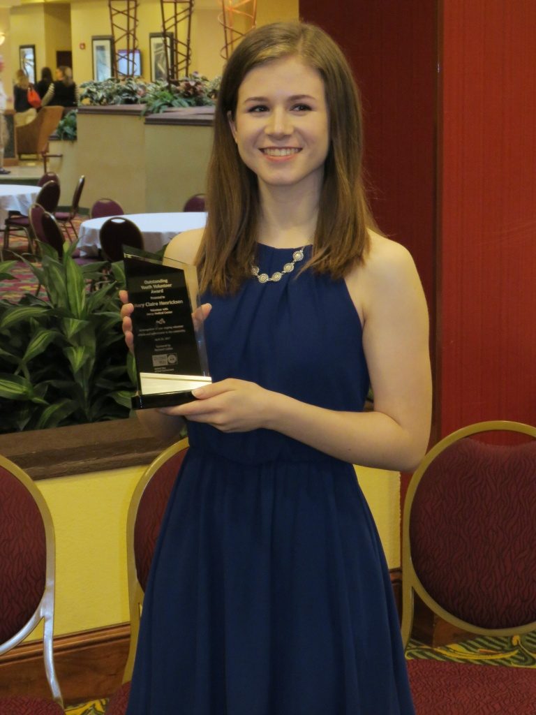 Senior Mary Claire Henricksen displays her United Way of East Central Iowa Youth Volunteer Award.