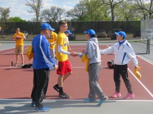 Linn-Mar High School Boys Tennis Team Player shakes had with Dubuque Wahlert Coaches