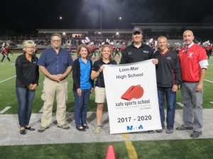 Representatives from UnityPoint Health present Linn-Mar representatives with the 2017-2020 Safe Sports Award. Pictured (left to right) are: Denise Walker, Dr. Thomas Richmann, and Carol Schueller from Unity Point-St Lukes and Athletic Trainers Marissa Yorgey, Vince Klopfenstein, Superintendent Quintin Shepherd and Athletic Director David Brown from the Linn-Mar Community School District.