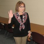 Board Member Sondra Nelson takes the oath of office as school board president