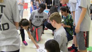 Students play a matching game at the OCM olympics