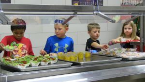 Kids choosing veggies in lunch line at Novak
