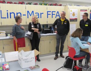 School Board members Bob Anderson and Tim Isenberg visit with Ms Lemer's class at Linn-Mar High School