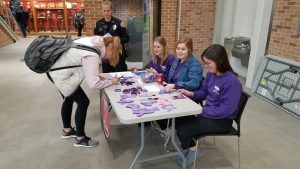 The Linn-Mar High School Group Standing Together Opposing Phones While Driving sells wristbands to raise awareness to the dangers of texting and driving