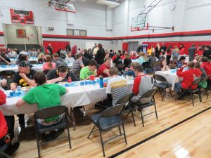 Linn-Mar administrators and staff and members of Students Opposed to Drugs and Alcohol and Teens Reach Youth enjoy a holiday party