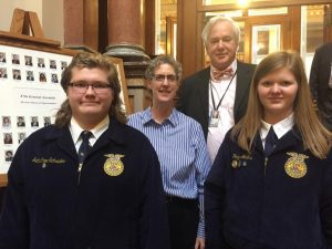Seth Crow Schrader Ms. Lemmer, and Paige Adams pictured with Art Staedt from the Iowa House in Des Moines.