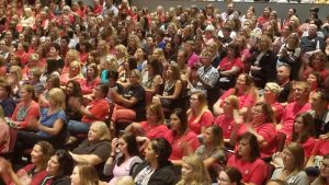 Staff clapping during All Staff Kickoff event