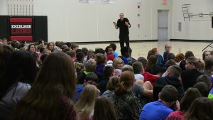 Trevor Ragan speaks to middle school students